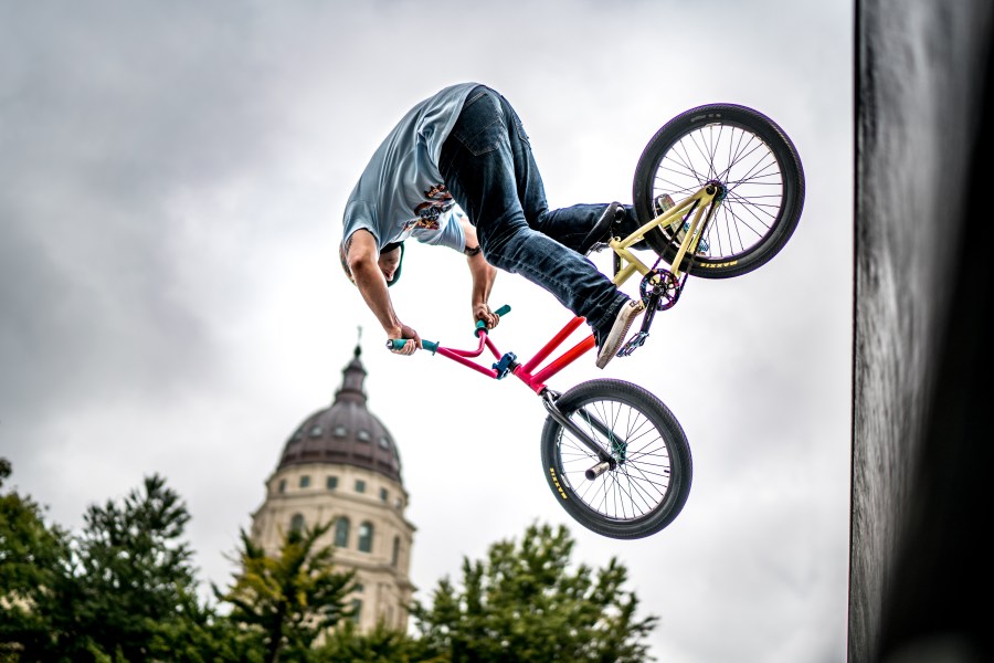 Lee Greaves, of the NoWear BMX Team, launches off the quarterpipe in front of the Capitol dome at Great Topeka Bike Fest on Sunday, September 30th. Photo by Josiah Engstrom, MotoVike Films.